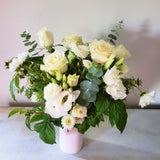 seasonal white flowers with greenery in vase