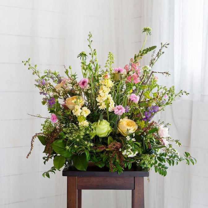 100% compostable, free-standing arrangement in soft pink, yellow, purple and green colors. like a meadow