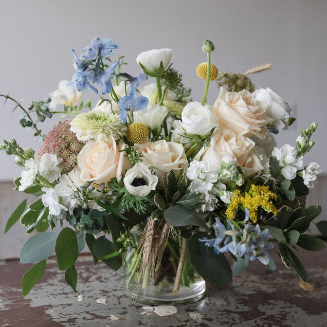 soft creamy whites with notes of blue and yellows in vase