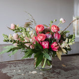 soft and bright pinks with greenery in vase